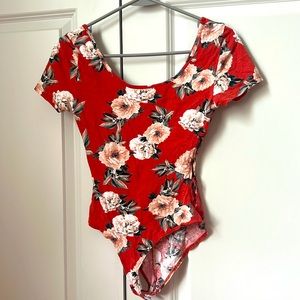 Orange floral bodysuit with rubbed sides from Charlotte Russe